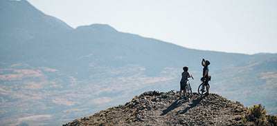 Cyclists overlooking hilltop